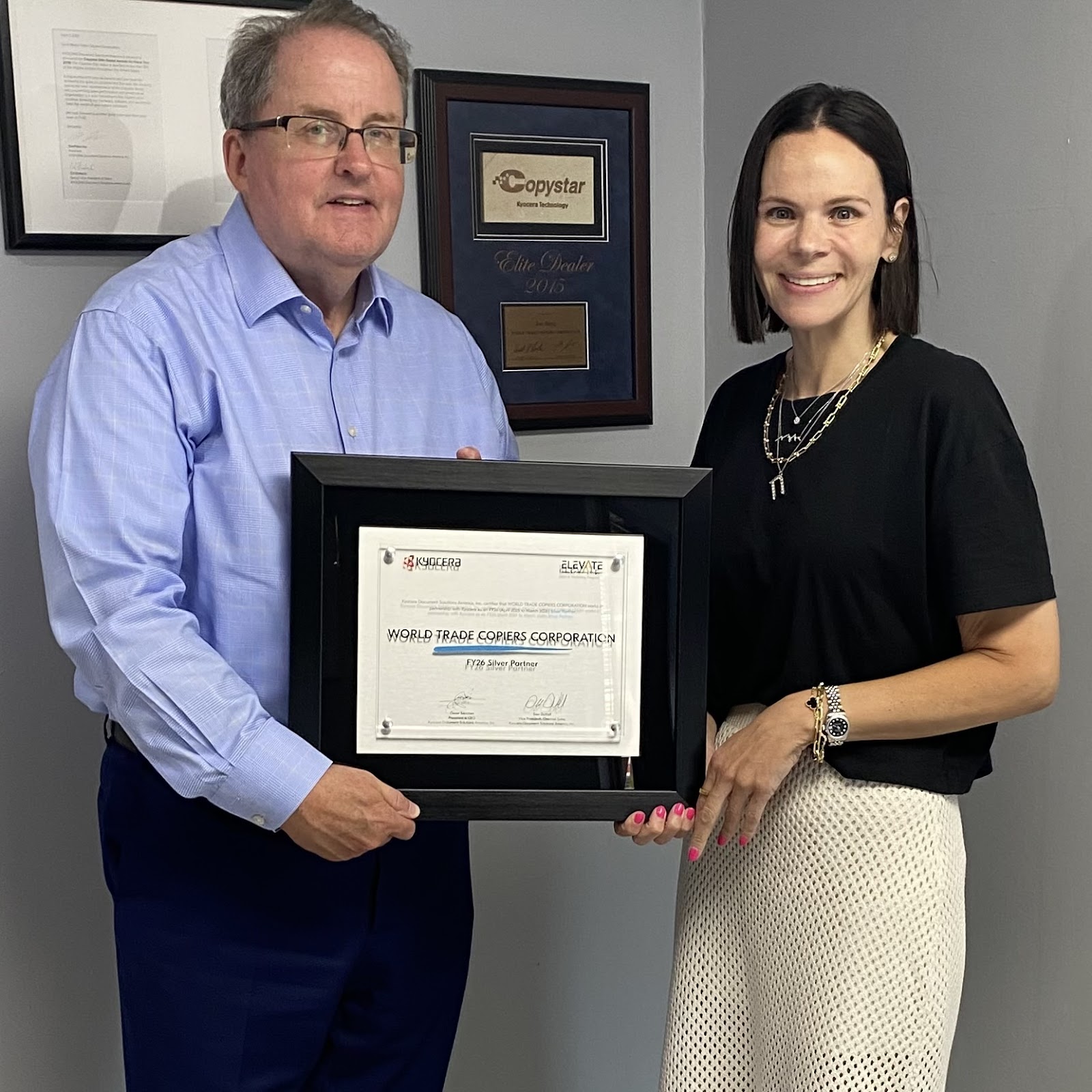 Hanna Holtzberg receiving Kyocera award for excellence in customer service